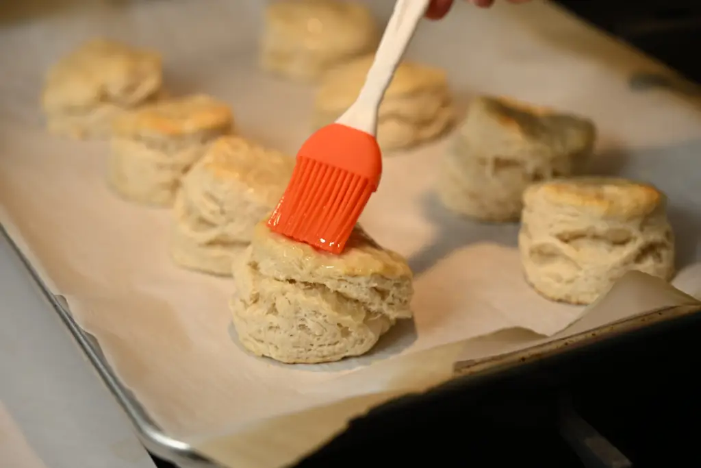Homemade biscuits topped with melted butter