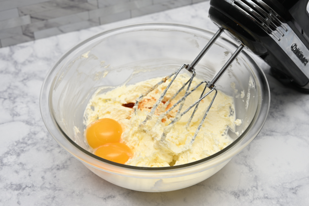 Add in egg yolks and vanilla