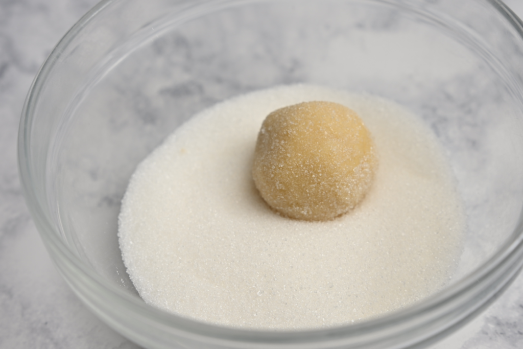 Roll dough ball in sugar