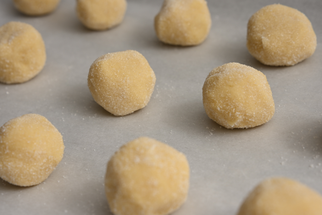 Place cookie dough balls on sheet pan
