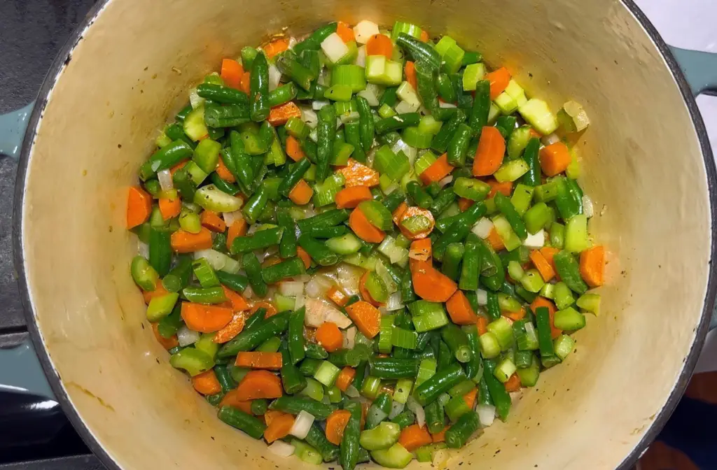 softened celery, carrots, onions, and green beans