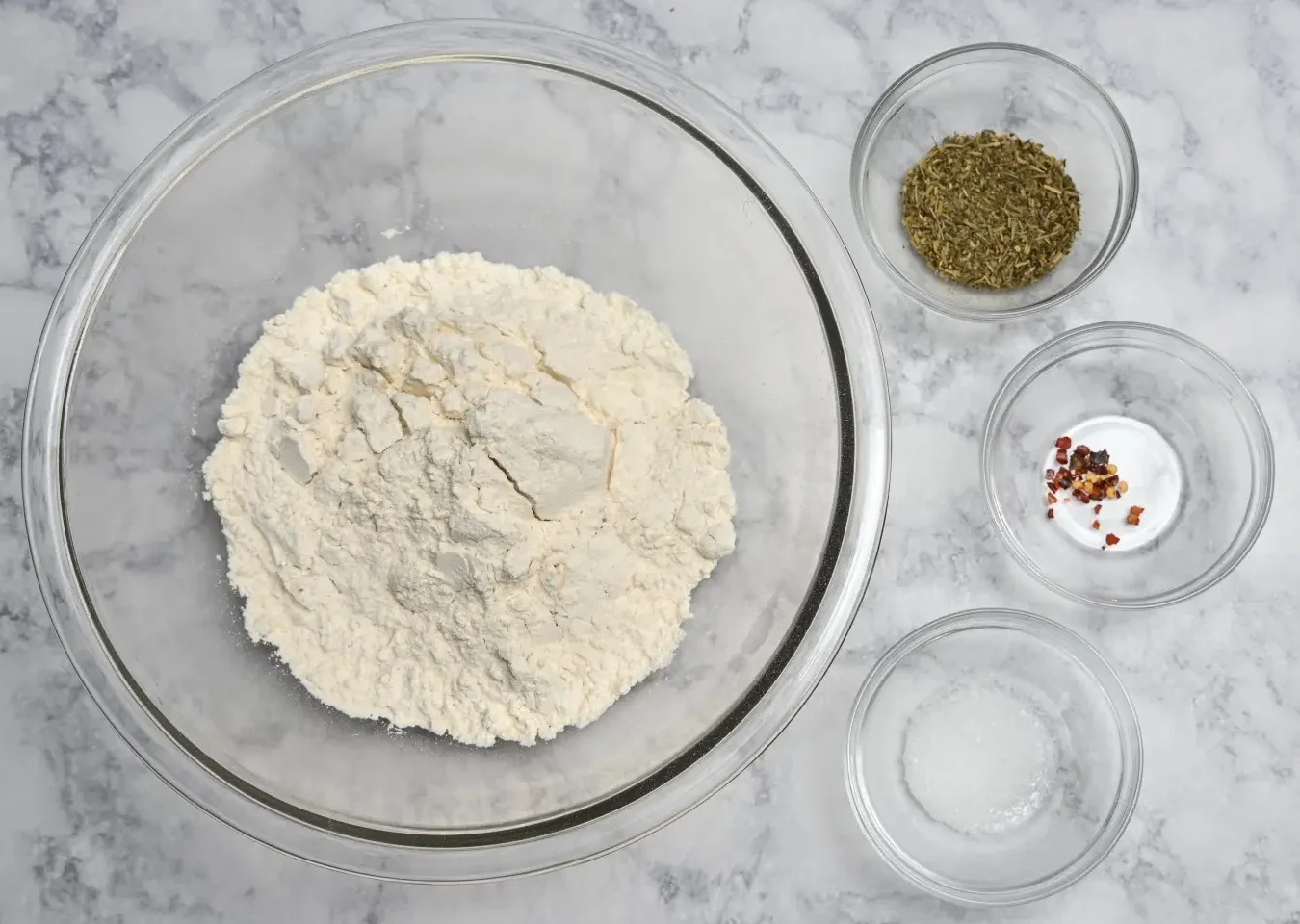 Italian seasoning, red pepper flakes, salt, and flour for Pepperoni Focaccia Bread
