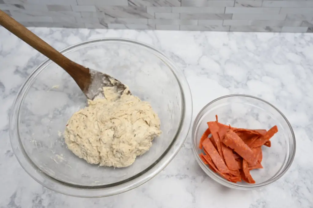 mix in sliced pepperoni