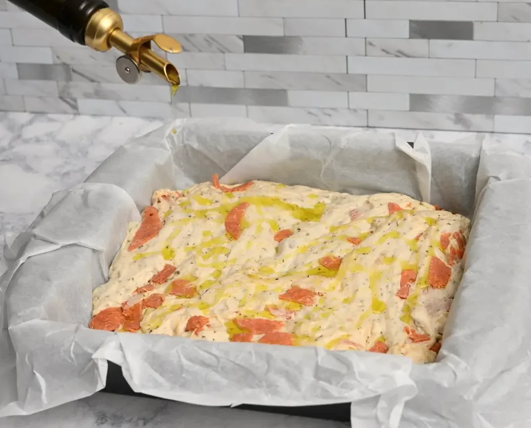drizzle oil on top of Pepperoni Focaccia Bread