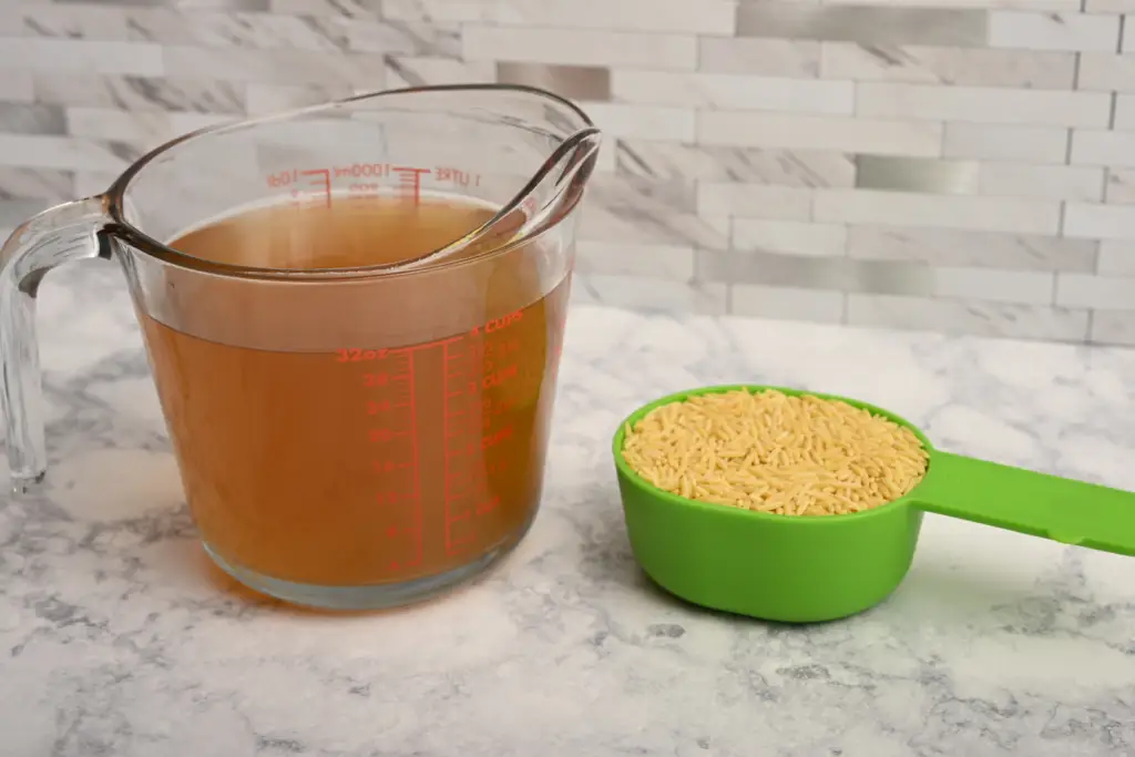 Chicken broth and orzo